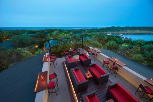 an overhead view of a deck with tables and chairs at Cinnamon Wild Yala in Yala