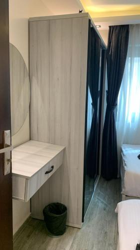 a bedroom with a dressing table and a mirror at Em banorama abrrtment hotel in Giza