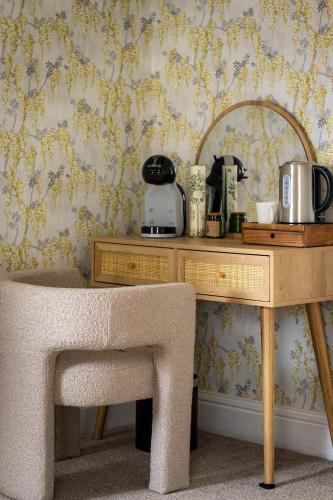 a wooden desk with a toaster on a wall at The Marlborough Inn in Marlborough