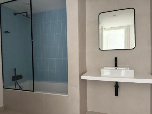 a bathroom with a sink and a mirror at Home2830 in Barreiro