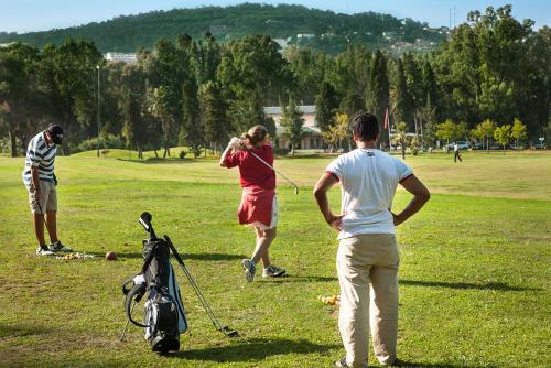 a group of people in a field flying a kite at Dar Tanja Boutique Hotel in Tangier