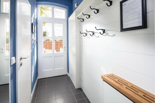 a hallway with a bench in a house at Rothen Huus in Norderney