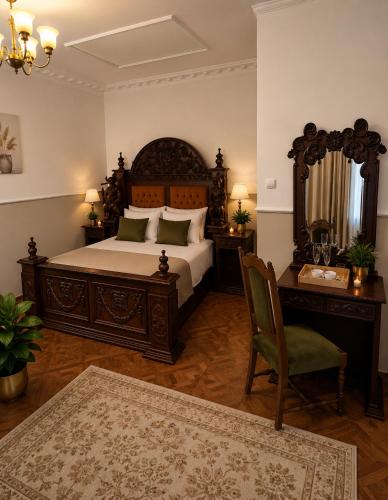a bedroom with a bed and a desk and a chair at Adria in Bieruń Nowy