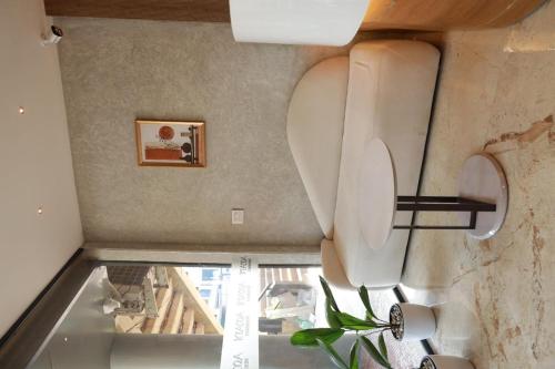 an overhead view of a bathroom with a toilet at Arma Residency Kannur in Kannur