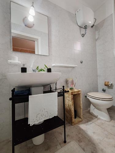 a bathroom with a sink and a toilet at Masseria Don Egidio in Melendugno