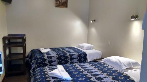 Ένα ή περισσότερα κρεβάτια σε δωμάτιο στο Casa Grande Colonial Palace