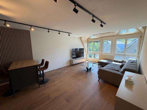 a living room with a couch and a table at City Apartments in Brunnen