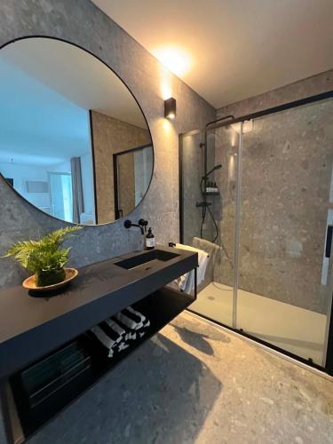 a bathroom with a sink and a mirror at Sogno La Vigna - Adults Only in Montegrosso dʼAsti