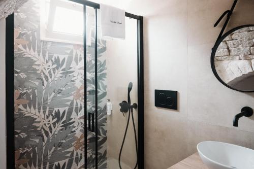a bathroom with a shower and a sink at Borgo Sant' Angelo Exclusive House in Conversano