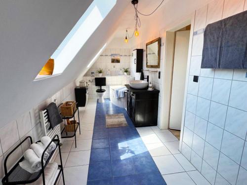 a bathroom with a sink and a toilet in a room at Ferienwohnung am Haff in Ueckermünde