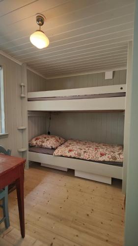a bedroom with two bunk beds in a room at Haus Hav in Ronneby