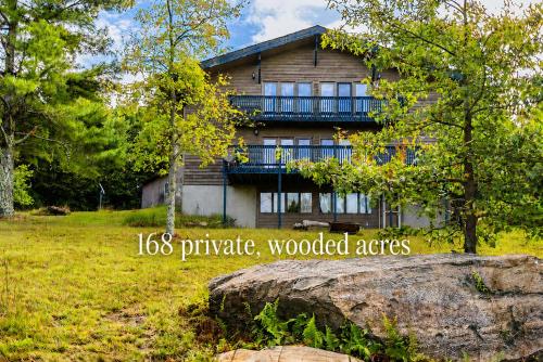 a house with a sign in front of it at 168 Secluded Acres Trails, Winery 5BR in Floyd