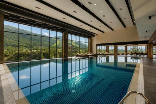 a swimming pool with a view of the mountains at Jermuk Hotel and SPA in Jermuk