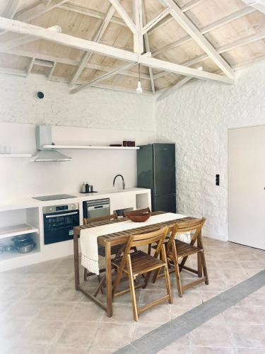 a kitchen with a table and chairs in a room at Anna home Elafonisos in Elafonisos
