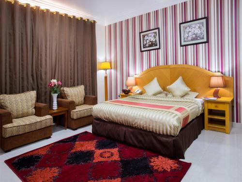 Postel nebo postele na pokoji v ubytování Safeer Hotel Suites
