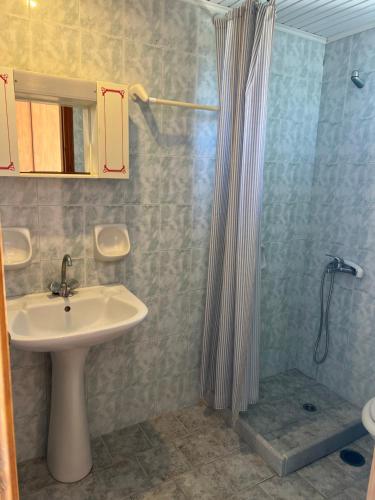 a bathroom with a sink and a shower at Prokopis Studios in Laganas