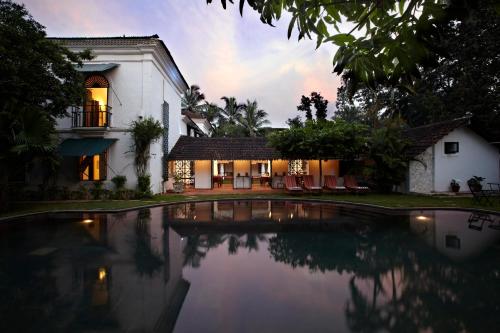 a house with a view of the water at Siolim House in Siolim