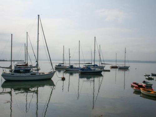 a group of boats sitting in the water at Dothan Farm Cottage in Cardenden