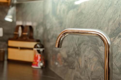 a close up of a kitchen sink with aaucet at Martin Villa 2 in Gjirokastër