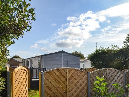 a view of a house from behind a fence at Atmospheric in Patrington