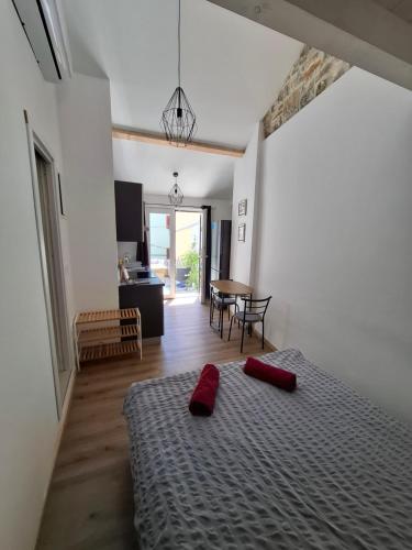 a bedroom with a bed with red pillows on it at Tre sorelle in Piran