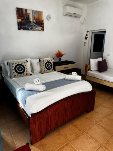 a bedroom with a large bed in a room at Erik Studio in Ksamil