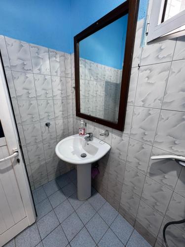 a bathroom with a sink and a mirror at Erik Studio in Ksamil