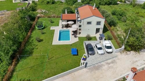 an aerial view of a house with a swimming pool at Casa Presika- Wellness, Fiber Net & Peace in Labin