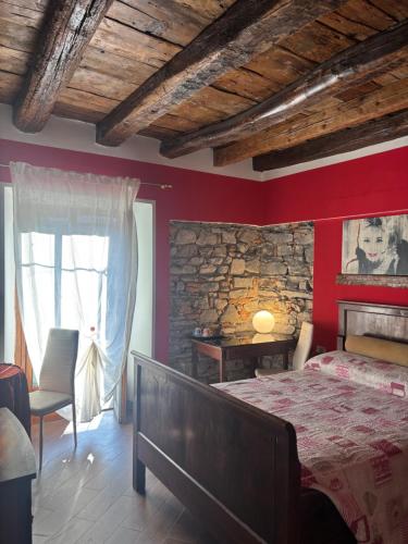 a bedroom with a bed and a stone wall at Storico in Como