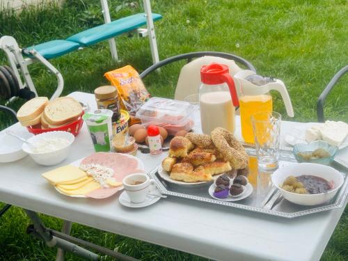 a picnic table with a tray of food and drinks at Camping Struga Macedonia in Struga
