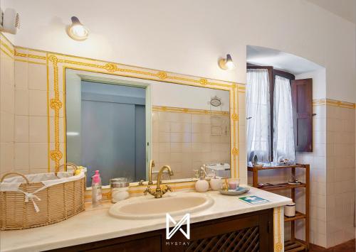 a bathroom with a sink and a mirror at MyStay - Monte dos Abrunhos in Vimieiro