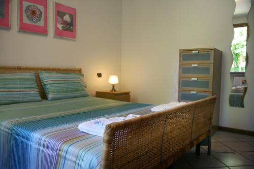 Кровать или кровати в номере Apartments I Ciclamini
