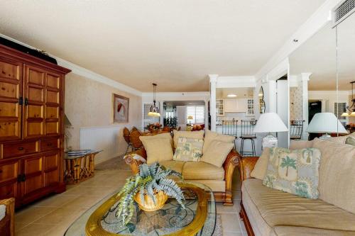 a living room with a couch and a table at Sea Colony oceanfront 4th floor condo with elevator in Bethany Beach