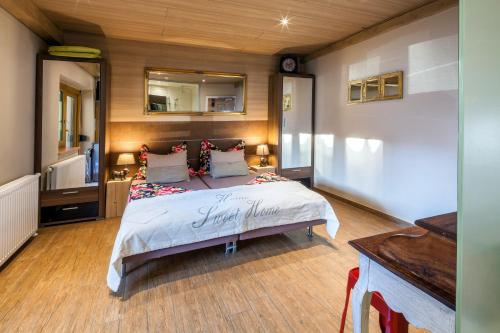 a bedroom with a large bed in a room at Gasthaus-Pension Reiterklause in Leutasch