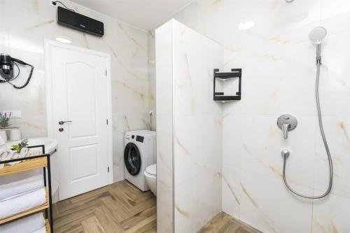 a bathroom with a shower and a toilet at Villa Olivarum in Stankovci