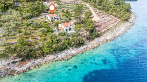 an aerial view of a house on an island in the water at House Vers in Vela Luka