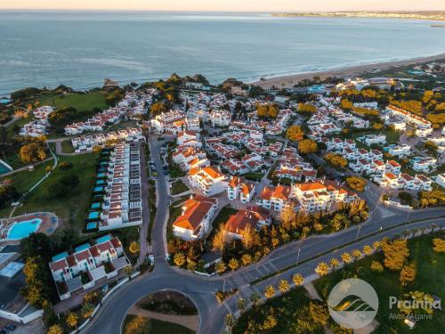 an aerial view of a resort near the ocean at Aldeamento Turistico da Prainha in Alvor