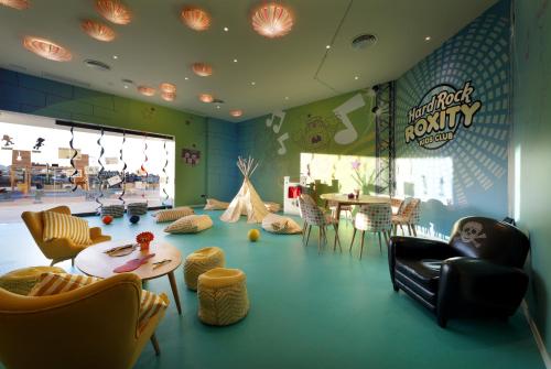 a childrens play room with a table and chairs at Hard Rock Hotel Tenerife in Adeje