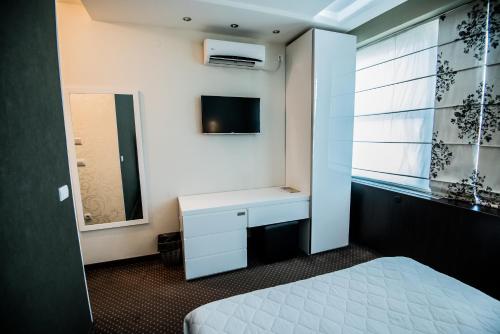 Centrum Sobe Rooms Čačakにあるベッド
