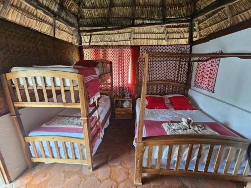 a bedroom with two bunk beds in a room at San Simian Lodge in La Laguna
