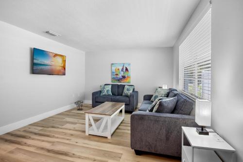 a living room with a couch and a table at A Place in Paradise Unit B in Anna Maria