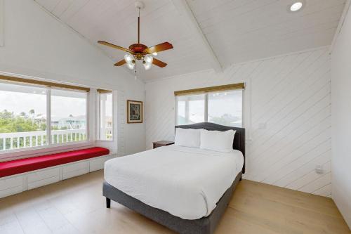 a bedroom with a bed and a ceiling fan at CJ295FLR Hawkins Lookout in Cudjoe Key