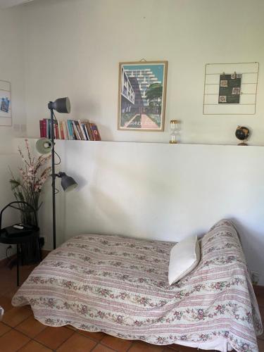 a bedroom with a bed with a blanket on it at La Maisonnette de Bédoin Mont Ventoux - Self Check In in Bédoin