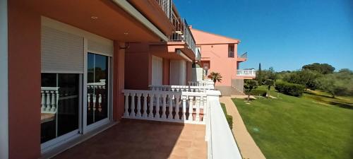 a balcony of a house with a white fence at Naturaleza y Golf in San Jorge