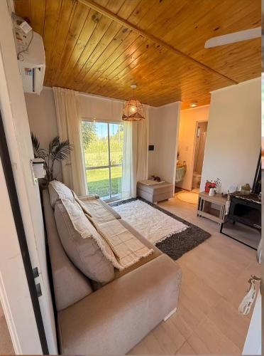 a bedroom with a bed and a large window at Casa de campo ElChale cerca del autodromo de Rafaela in Rafaela