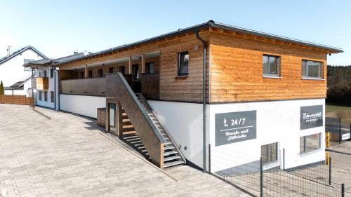 a building with a staircase on the side of it at Schreinerfeld-Appartements in Ergolding