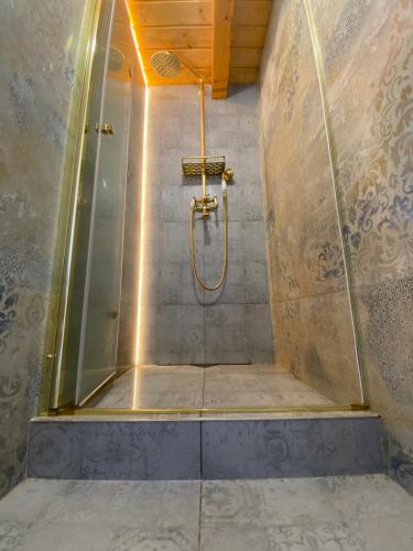 a shower with a glass door in a bathroom at Cassovia Hostel in Košice