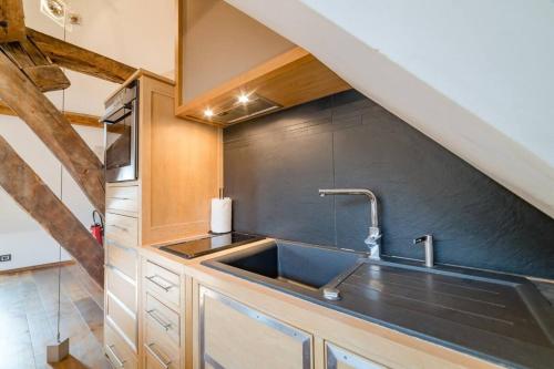 a kitchen with a sink and a counter top at Robillard 2 - Bail Partner in Auxerre