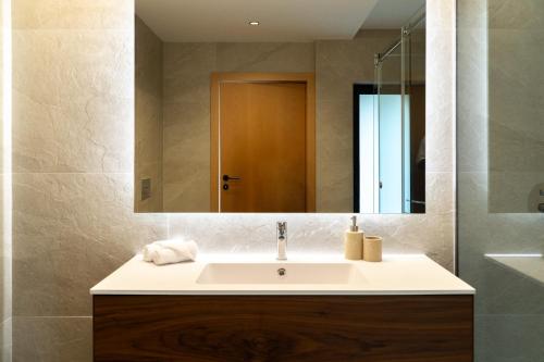 a bathroom with a sink and a mirror at Casa Encosta do Monte in Póvoa de Lanhoso