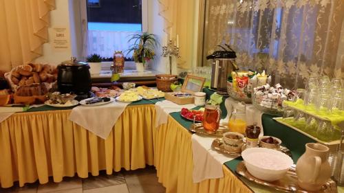 a table with a buffet of food on it at Schwarzes Ross Hotel & Restaurant Oberwiesenthal in Kurort Oberwiesenthal